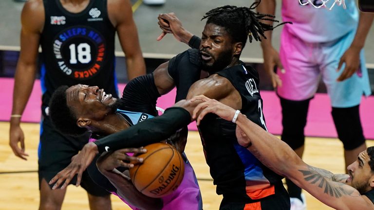 New York Knicks center Nerlens Noel (3) and forward Obi Toppin (1) block a shot to the basket by Miami Heat center Bam Adebayo (13) during the second half of an NBA basketball game, Tuesday, Feb. 9, 2021, in Miami.