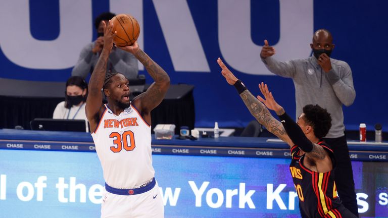 New York Knicks&#39; Julius Randle (30) shoots against Atlanta Hawks&#39; John Collins (20) during the first quarter of an NBA basketball game Monday, Feb. 15, 2021, in New York. (AP Photo/Jason DeCrow, Pool)


