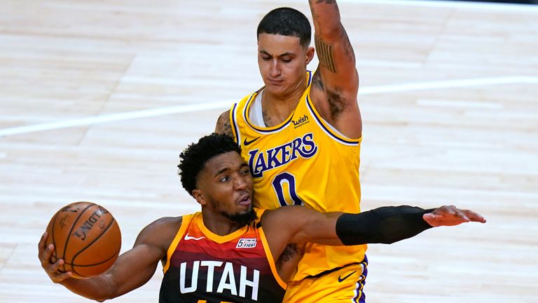 Utah Jazz guard Donovan Mitchell (45) drives against Los Angeles Lakers forward Kyle Kuzma (0) during the second half of an NBA basketball game Wednesday, Feb. 24, 2021, in Salt Lake City. (AP Photo/Rick Bowmer)


