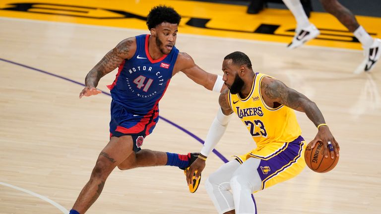 Los Angeles Lakers forward LeBron James (23) is defended by Detroit Pistons forward Saddiq Bey (41) during the first half of an NBA basketball game Saturday, Feb. 6, 2021, in Los Angeles. (AP Photo/Marcio Jose Sanchez)


