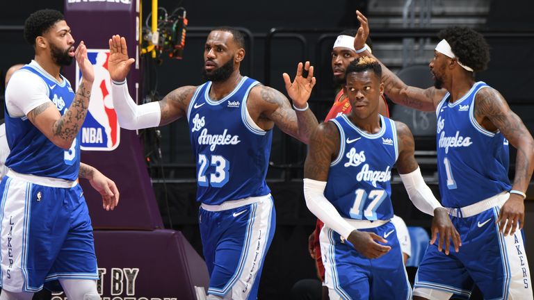 Anthony Davis, LeBron James, Dennis Schröder and Kentavious Caldwell-Pope high five after a basket for the Los Angeles Lakers