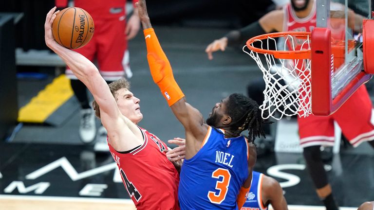 Chicago Bulls' Lauri Markkanen, third from left, goes for a dunk against New York Knicks' Nerlens Noel (3) during the first half of an NBA basketball game Monday, Feb. 1, 2021, in Chicago. 