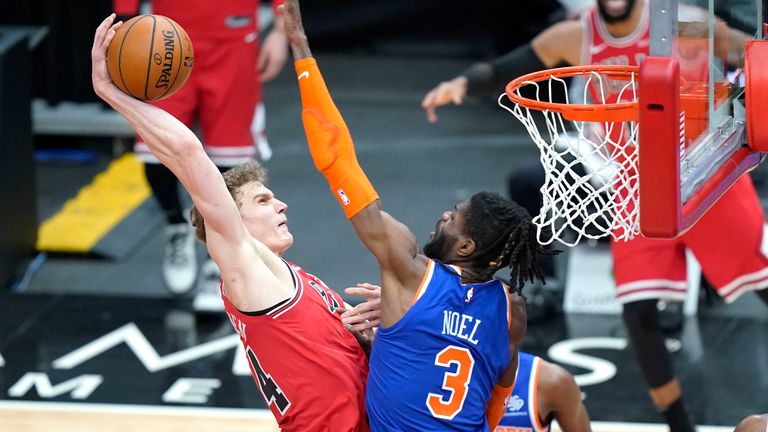 Chicago Bulls&#39; Lauri Markkanen, third from left, goes for a dunk against New York Knicks&#39; Nerlens Noel (3) during the first half of an NBA basketball game Monday, Feb. 1, 2021, in Chicago. 