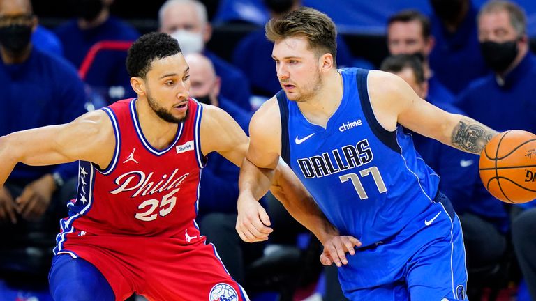 Dallas Mavericks&#39; Luka Doncic (77) tries to dribble past Philadelphia 76ers&#39; Ben Simmons (25) during the second half of an NBA basketball game, Thursday, Feb. 25, 2021, in Philadelphia.