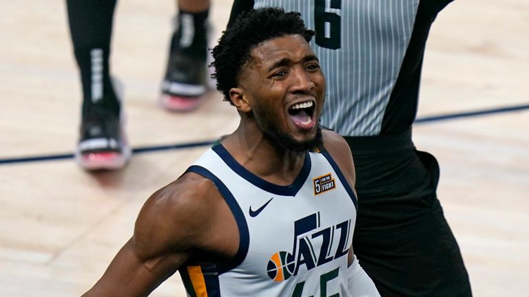 Utah Jazz guard Donovan Mitchell (45) reacts after scoring against the Boston Celtics in the second half during an NBA basketball game Tuesday, Feb. 9, 2021, in Salt Lake City.