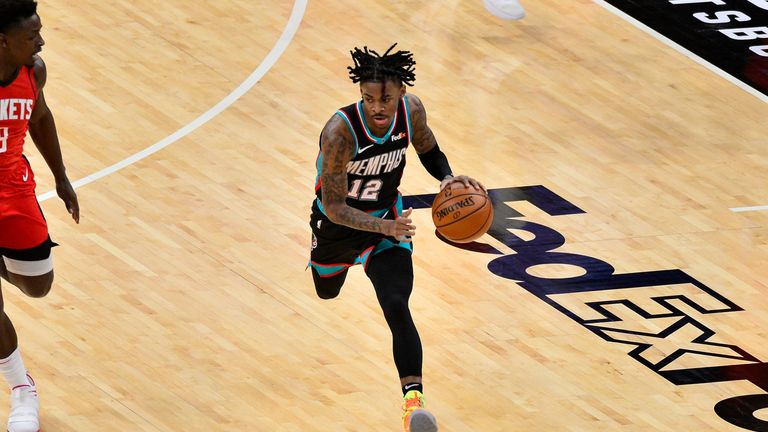Memphis Grizzlies guard Ja Morant (12) plays in the first half of an NBA basketball game against the Houston Rockets Thursday, Feb. 4, 2021, in Memphis, Tenn. (AP Photo/Brandon Dill)


