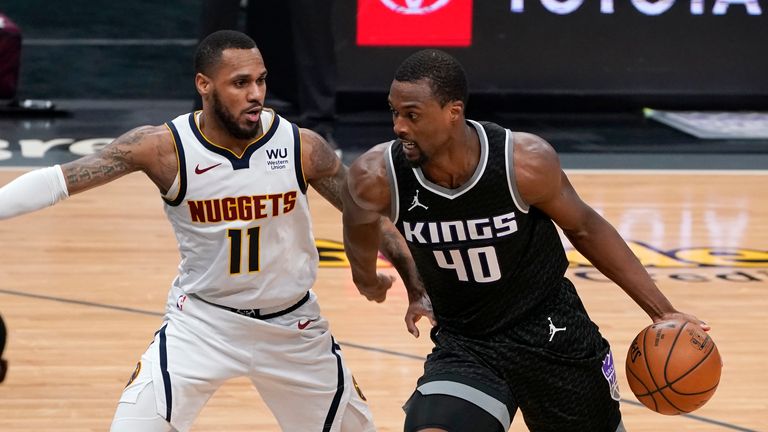 Sacramento Kings forward Harrison Barnes, right, drives against Denver Nuggets guard Monte Morris during the second half of an NBA basketball game in Sacramento, Calif., Saturday, Feb. 6, 2021. The Kings won 119-114. (AP Photo/Rich Pedroncelli)


