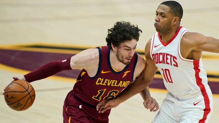 Cleveland Cavaliers&#39; Cedi Osman (16) drives against Houston Rockets&#39; Eric Gordon (10) in the first half of an NBA basketball game, Wednesday, Feb. 24, 2021, in Cleveland. (AP Photo/Tony Dejak)


