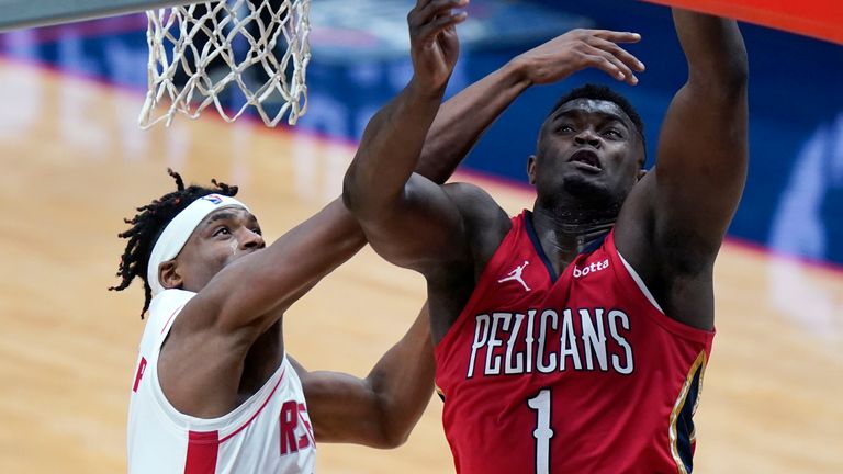 New Orleans Pelicans forward Zion Williamson (1) goes to the basket against Houston Rockets forward Danuel House Jr. in the second half of an NBA basketball game in New Orleans, Tuesday, Feb. 9, 2021. The Pelicans won 130-101.