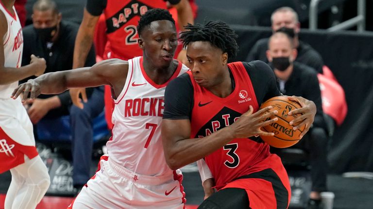 Toronto Raptors forward OG Anunoby (3) drives into Houston Rockets guard Victor Oladipo (7) during the first half of an NBA basketball game Friday, Feb. 26, 2021, in Tampa, Fla. (AP Photo/Chris O'Meara)


