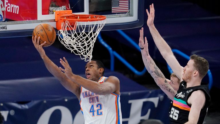 Oklahoma City Thunder center Al Horford (42) shoots in front of San Antonio Spurs center Jakob Poeltl and forward Luka Samanic, rear, during the first half of an NBA basketball game Wednesday, Feb. 24, 2021, in Oklahoma City. (AP Photo/Sue Ogrocki)


