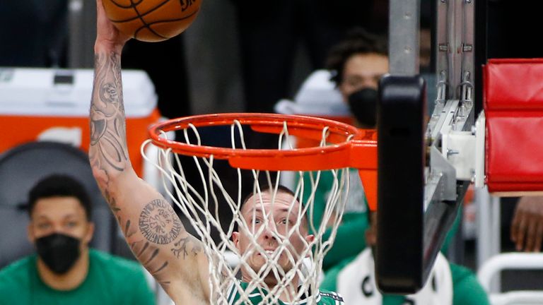Boston Celtics forward Daniel Theis (27) dunks the ball against the Phoenix Suns during the second half of an NBA basketball game, Sunday, Feb. 7, 2021, in Phoenix. (AP Photo/Ralph Freso)



