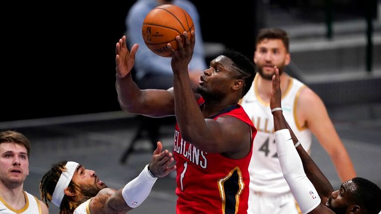 AP - New Orleans Pelicans forward Zion Williamson (1) shoots between Dallas Mavericks&#39; Willie Cauley-Stein and Tim Hardaway Jr.,