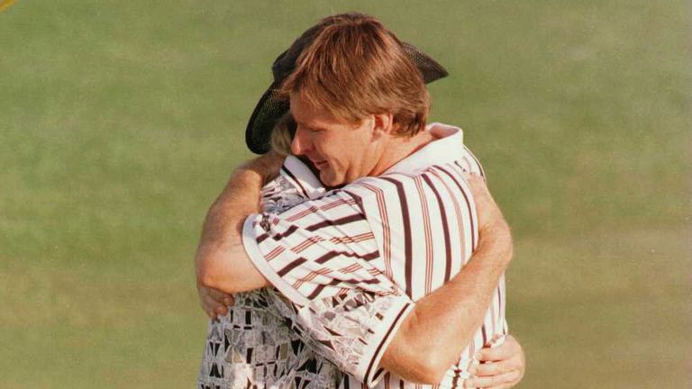 Nick Faldo of England hugs Greg Norman of Australia on the 18th green after winning the 1996 Masters during the final round of the 1996 Masters at Augusta National Golf Club in Augusta