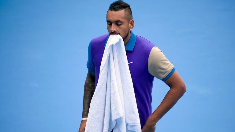 Australia's Nick Kyrgios walk to serve to France's Alexandre Muller during a tuneup tournament ahead of the Australian Open tennis championships in Melbourne, Australia, Tuesday, Feb. 2, 2021. (AP Photo/Andrew Brownbill)