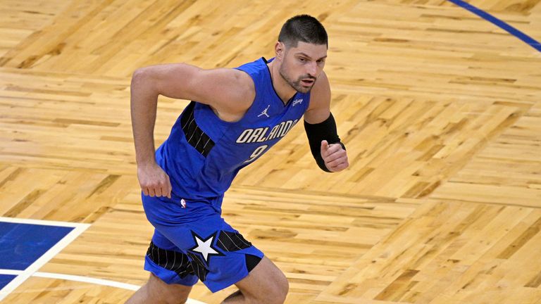 Orlando Magic center Nikola Vucevic runs up the court during the first half of an NBA basketball game against the Golden State Warriors