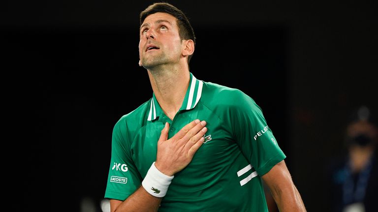 Novak Djokovic reacts after defeating Germany's Alexander Zverev in their quarterfinal match at the Australian Open tennis championship in Melbourne, Australia, Wednesday, Feb. 17, 2021.(AP Photo/Andy Brownbill)