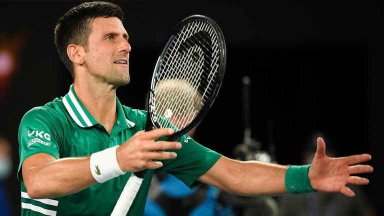 Novak Djokovic celebrates after defeating Germany's Alexander Zverev in their quarterfinal match at the Australian Open tennis championship in Melbourne, Australia, Wednesday, Feb. 17, 2021.(AP Photo/Andy Brownbill)