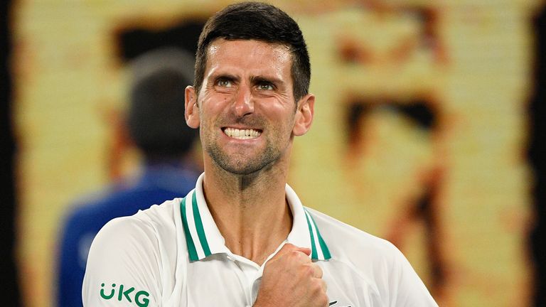 Novak Djokovic celebrates after defeating Russia&#39;s Aslan Karatsev in their semifinal match at the Australian Open tennis championship in Melbourne, Australia, Thursday, Feb. 18, 2021.(AP Photo/Andy Brownbill)