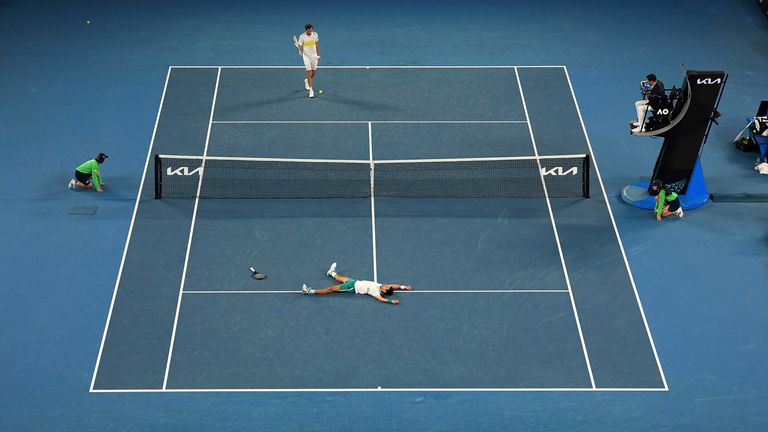 Novak Djokovic dropped to the court in celebration after beating Daniil Medvedev 