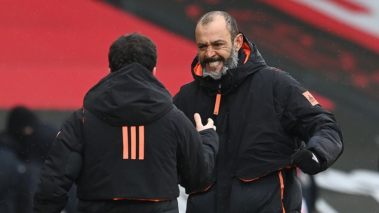 Nuno Espirito Santo celebrates with a member of his Wolves coaching staff