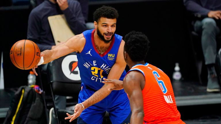 AP - Denver Nuggets guard Jamal Murray, back, passes the ball as Oklahoma City Thunder guard Hamidou Diallo