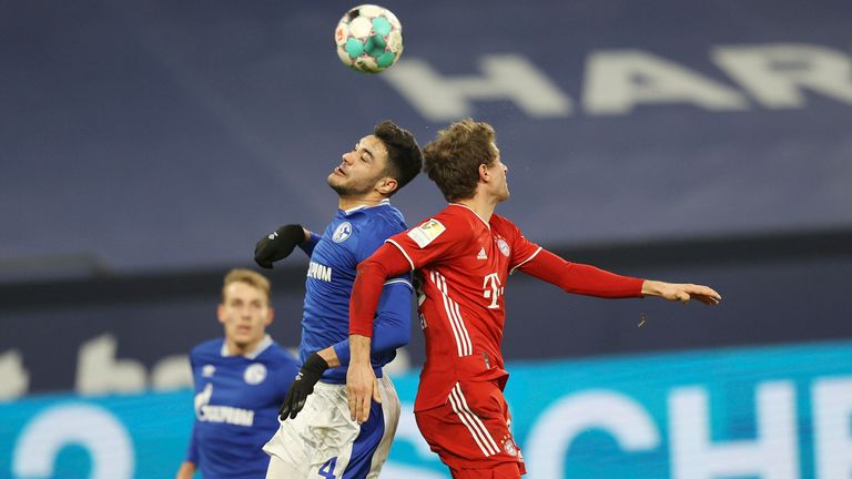 Ozan Kabak challenges Thomas Muller for the ball - AP Images