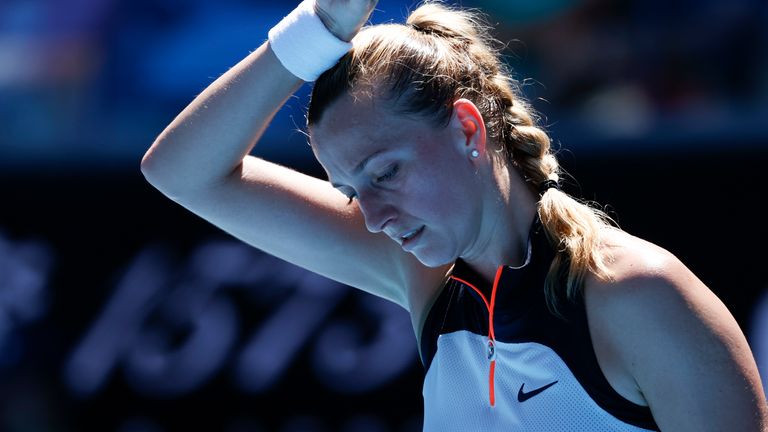 Petra Kvitova of the Czech Republic wipes the sweat from her face during her second round match against Romania's Sorana Cirstea at the Australian Open tennis championship in Melbourne, Australia, Wednesday, Feb. 10, 2021.(AP Photo/Rick Rycroft)