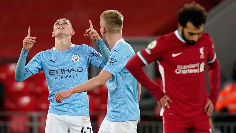 Phil Foden points skywards after putting Man City 4-1 ahead against Liverpool