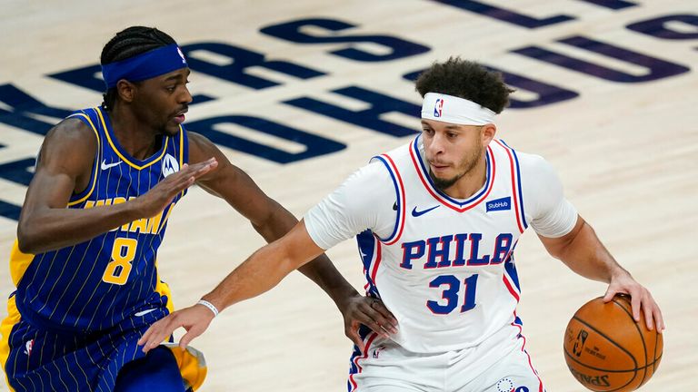 AP - Philadelphia 76ers&#39; Seth Curry (31) is defended by Indiana Pacers&#39; Justin Holiday (8)