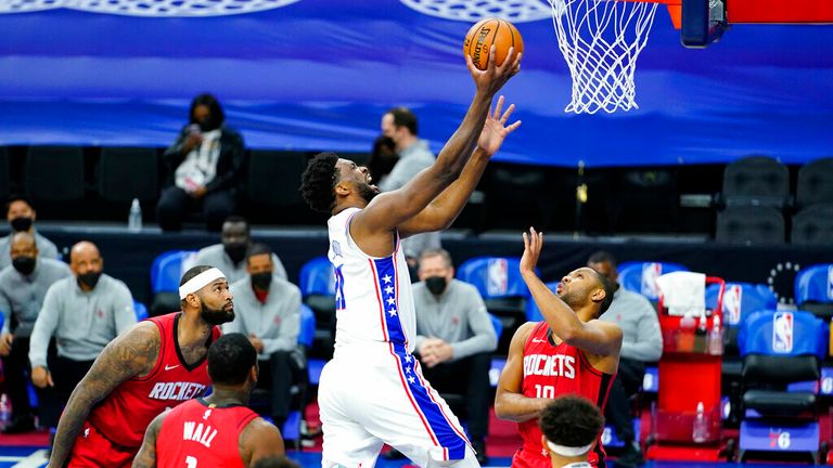 AP - &#39; Joel Embiid, center, goes up for a shot against Houston Rockets&#39; Eric Gordon