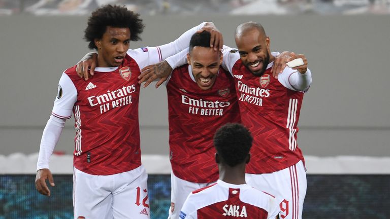 Pierre-Emerick Aubameyang celebrates scoring Arsenal&#39;s third against Benfica