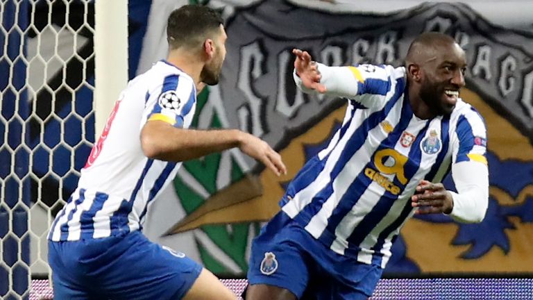 Porto's Moussa Marega, right, celebrates after scoring his side's second goal during the Champions League round of 16, first leg, soccer match between FC Porto and Juventus at the Dragao stadium in Porto, Portugal, Wednesday, Feb. 17, 2021. (AP Photo/Luis Vieira)
