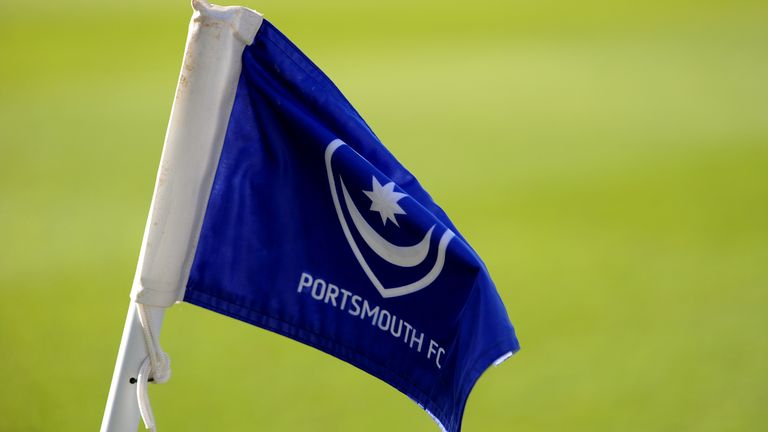 Flag bearing the club crest and logo of Portsmouth FC at Fratton Park (PA Images)