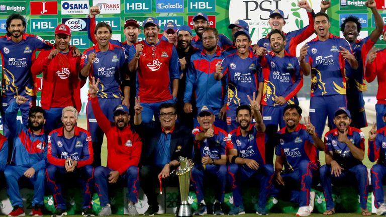 Karachi Kings officials and players pose with winning trophy after the final of Pakistan Super League T20 cricket match against Lahore Qalandars at National Stadium in Karachi, Pakistan, Tuesday, Nov. 17, 2020. (AP Photo/Fareed Khan)..
