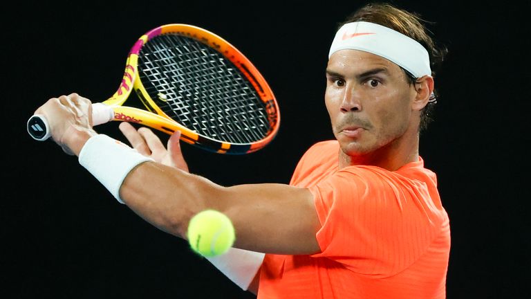 Rafael Nadal makes a backhand return to Michael Mmoh during their second round match at the Australian Open. (AP Photo/Rick Rycroft)