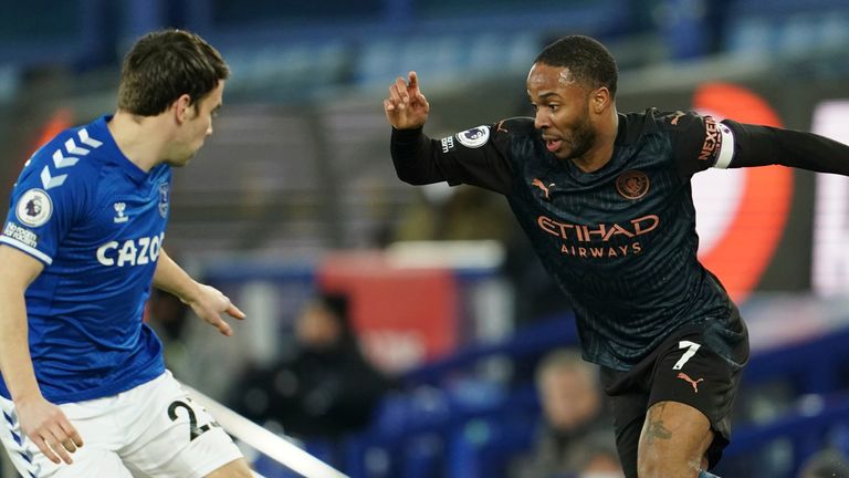 Raheem Sterling runs at Seamus Coleman, who replaced Mina for Everton