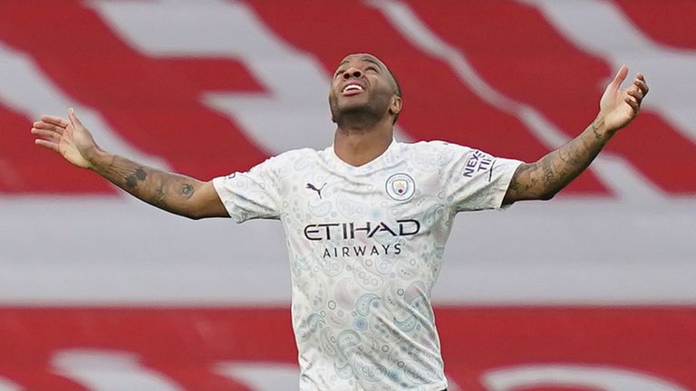Raheem Sterling celebrates after scoring early at The Emirates