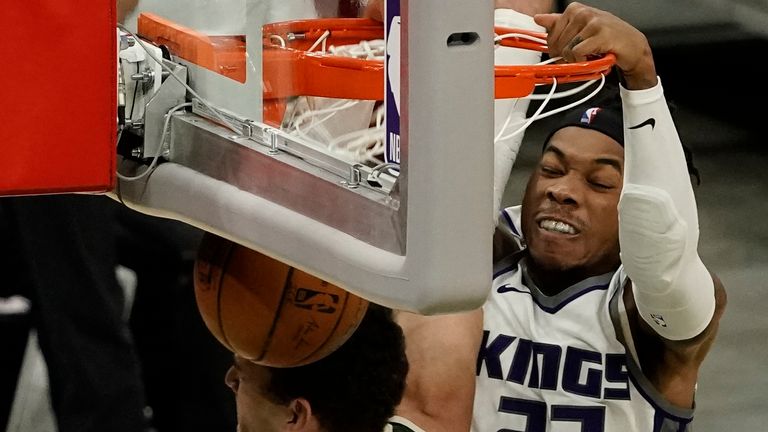 Sacramento Kings' Richaun Holmes dunks on Milwaukee Bucks' Brook Lopez