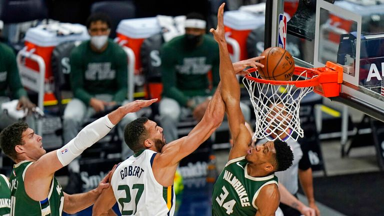 AP - Utah Jazz center Rudy Gobert (27) dunks between Milwaukee Bucks&#39; Brook Lopez (11) and Giannis Antetokounmpo (34) 