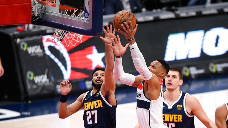 AP - Washington Wizards guard Russell Westbrook, center, goes to the basket against Denver Nuggets guard Jamal Murray