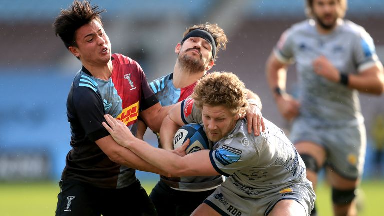 Sale Sharks' Robert du Preez (right) is tackled by Harlequins' Danny Care (centre) during the Gallagher Premiership match at Twickenham Stoop, London. Picture date: Saturday February 20, 2021.