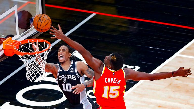 AP - San Antonio Spurs forward DeMar DeRozan (10) reacts as he is fouled by Atlanta Hawks center Clint Capela