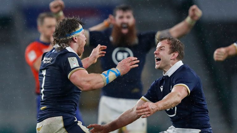 Scotland's Hamish Watson, left, and Scotland's Scott Steele celebrate at the end of  the Six Nations rugby union international between England and Scotland at Twickenham stadium in London, Saturday, Feb. 6, 2021. Scotland won the match 11-6. (AP Photo/Alastair Grant)..