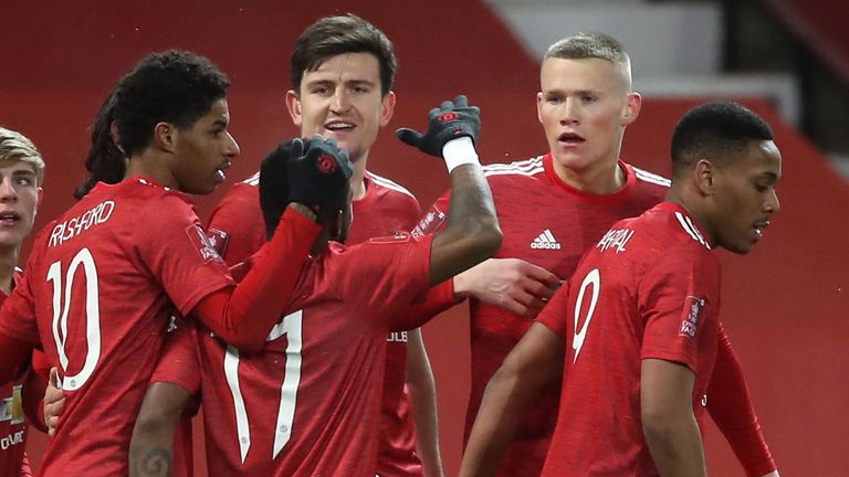 Scott McTominay celebrates with team-mates after giving Man Utd an extra-time lead against West Ham