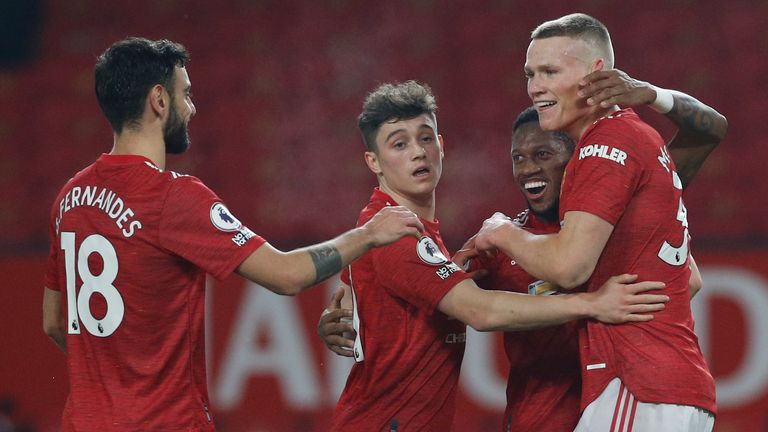 Scott McTominay celebrates with team-mates after scoring Man Utd's sixth (AP)