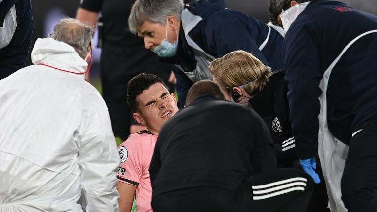 Sheffield United's John Egan was carried off on a stretcher late on in the defeat at West Ham on Monday evening