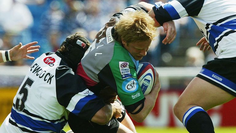 TWICKENHAM, ENGLAND - MAY 2:  Simon Miall of Harlequins is tackled by Danny Grewcock during the Zurich Premiership match between Harlequins and Bath at The Stoop Ground on May 2, 2004 in Twickenham, England.  (Photo by David Rogers/Getty Images)............ *** Local Caption *** Simon Miall;Danny Grewcock