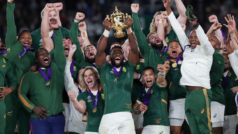 South Africa's Siya Kolisi (centre) lifts the trophy as South Africa win the 2019 Rugby World Cup final match at Yokohama Stadium.                                                                                                                                                                                                                                                                                                                                    