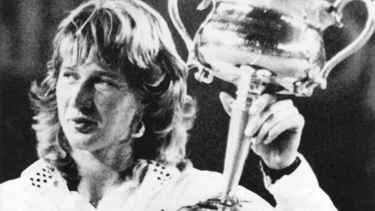 German tennis player Steffi Graf holds the Daphne Akhurst Memorial Cup after winning the women's singles title at the Australian Open tennis tournament on 23 Jan. 1988, in Melbourne, Australia. Graf beat America's Chris Evert 6-1, 7-6.
